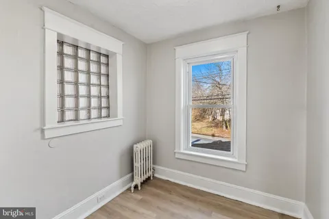 a view of room with window and furniture