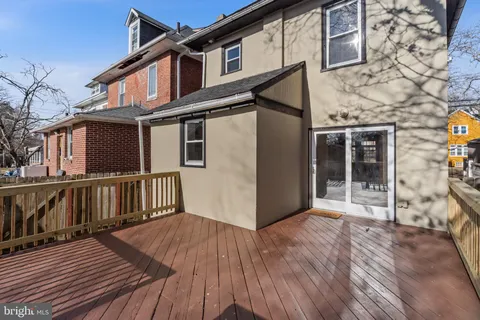 a view of a house with wooden deck