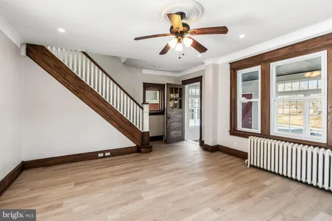 a view of an entryway with wooden floor