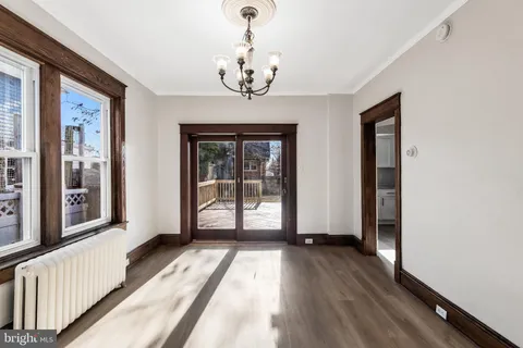 a view of a room with wooden floor