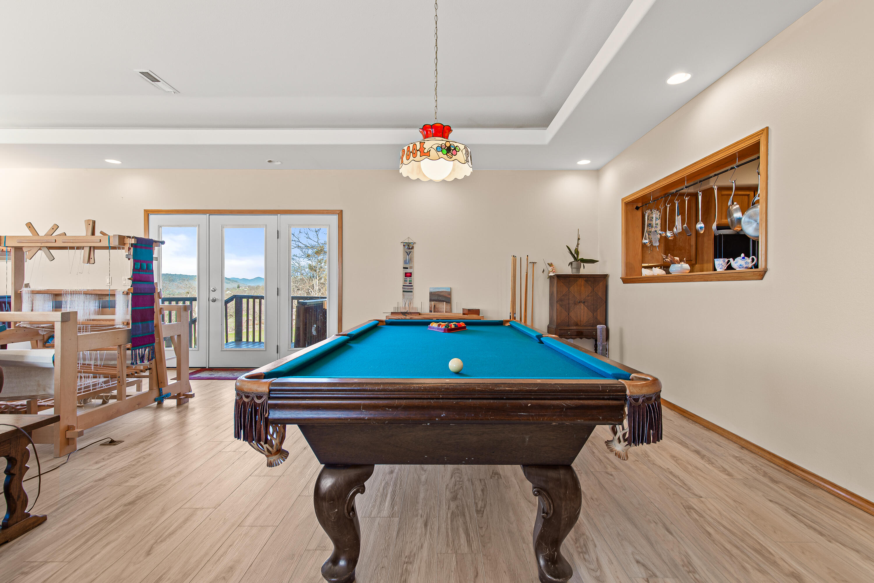 924 West Linn Road Eagle Point, OR 97524 - Photo 20 of 58 a room with wooden floors pool table and windows