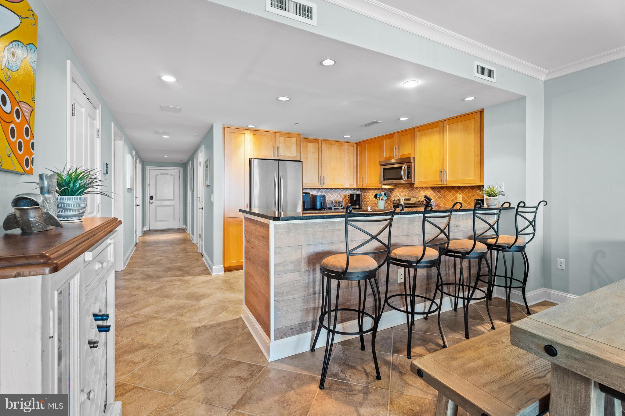 6 60th Street, Unit 102 Ocean City, MD 21842 - Photo 11 of 58 a view of a dining room with furniture