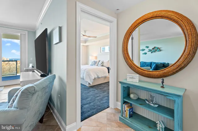 a living room with furniture and a mirror