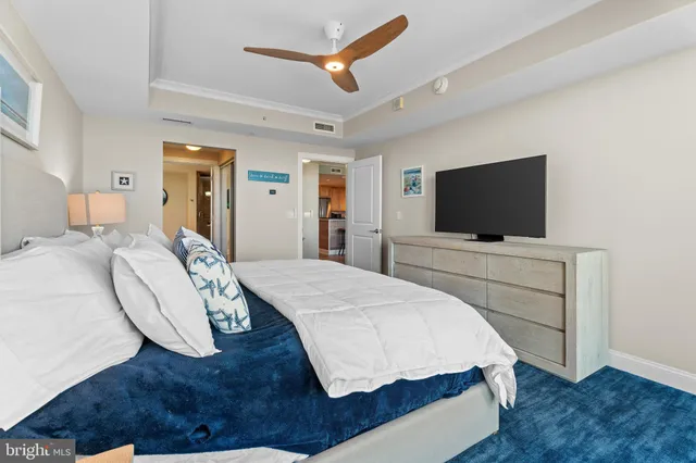 a bed room with a bed and a television