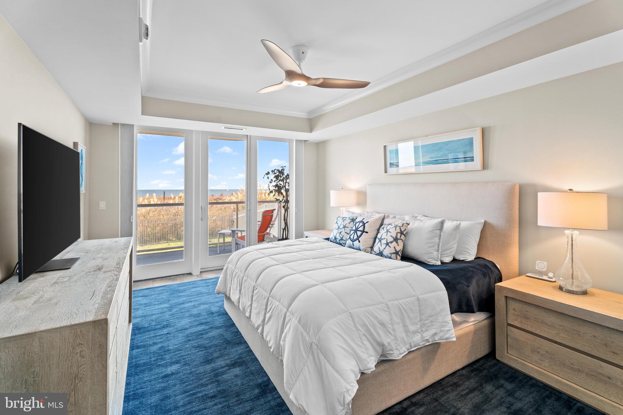 6 60th Street, Unit 102 Ocean City, MD 21842 - Photo 21 of 58 a bed room with a bed and a television