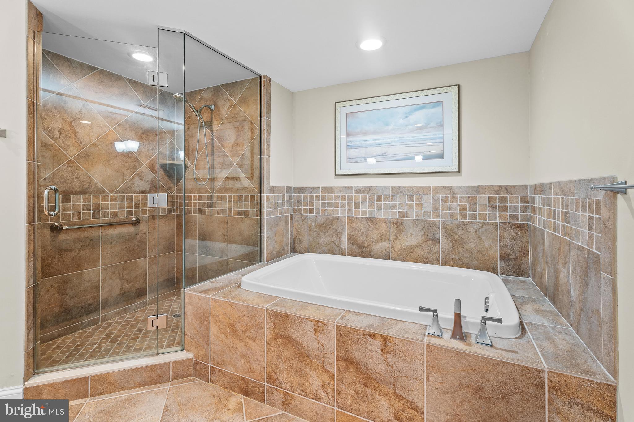 6 60th Street, Unit 102 Ocean City, MD 21842 - Photo 25 of 58 a bathroom with a bathtub and shower