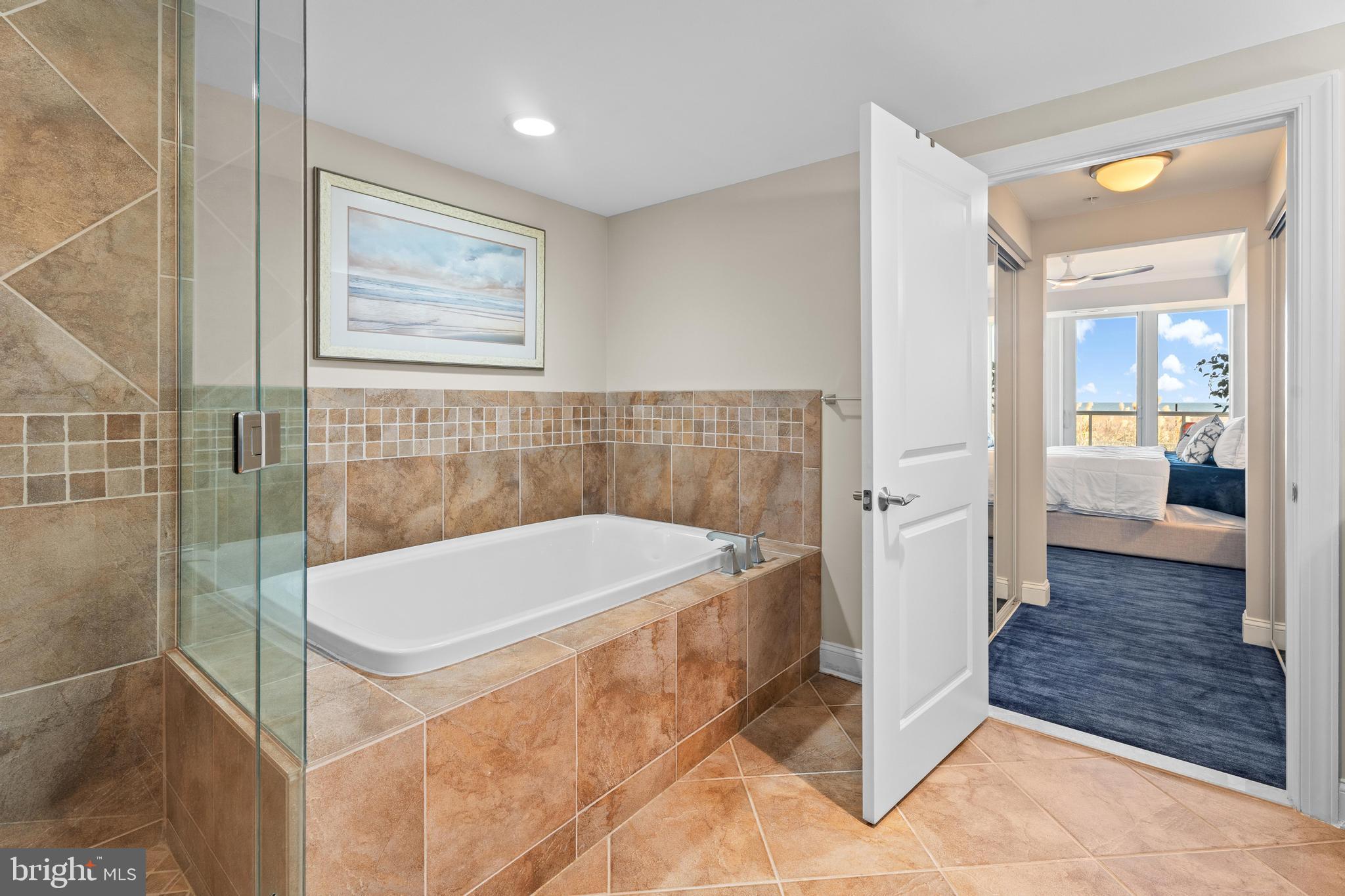 6 60th Street, Unit 102 Ocean City, MD 21842 - Photo 26 of 58 a bathroom with a bathtub and a shower