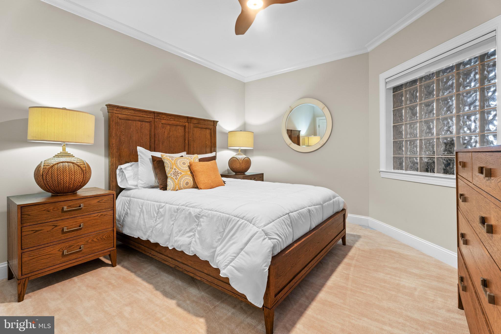 6 60th Street, Unit 102 Ocean City, MD 21842 - Photo 35 of 58 a bedroom with a bed and window