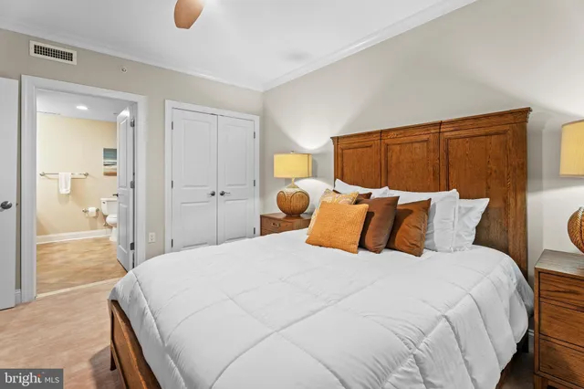 a bedroom with a bed and a dresser