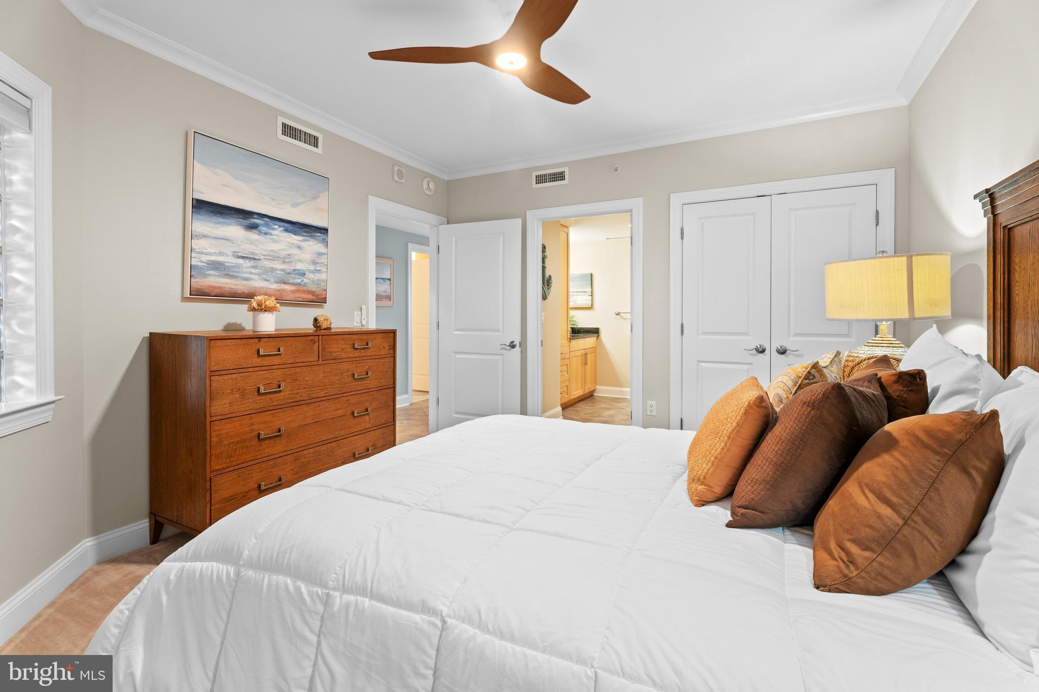 6 60th Street, Unit 102 Ocean City, MD 21842 - Photo 37 of 58 a bedroom with a bed and wooden floor