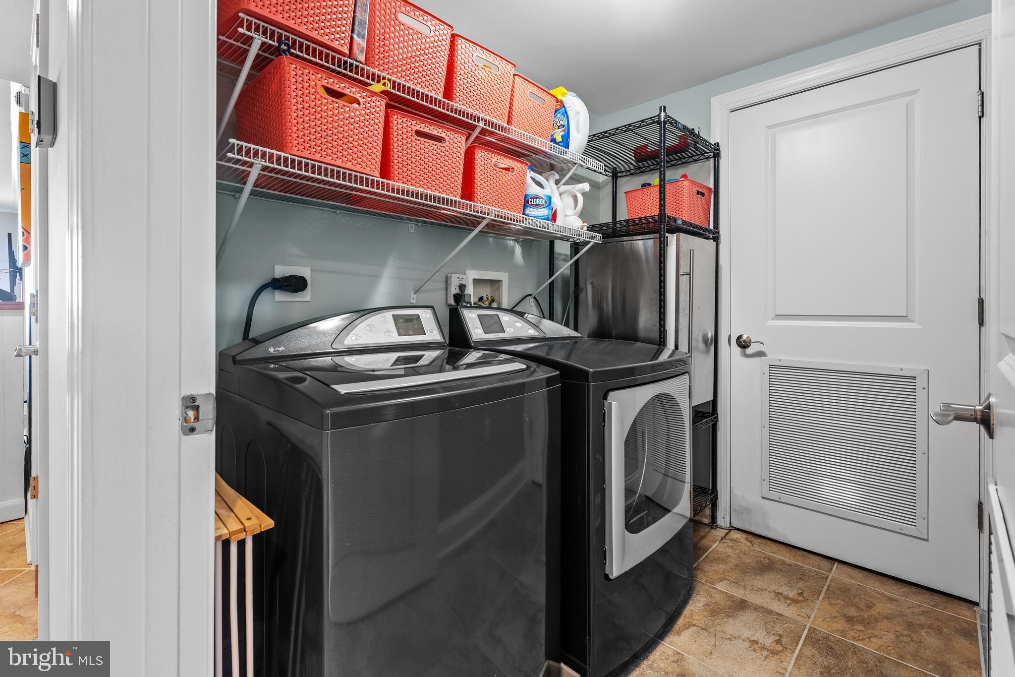 6 60th Street, Unit 102 Ocean City, MD 21842 - Photo 43 of 58 a utility room with dryer and washer
