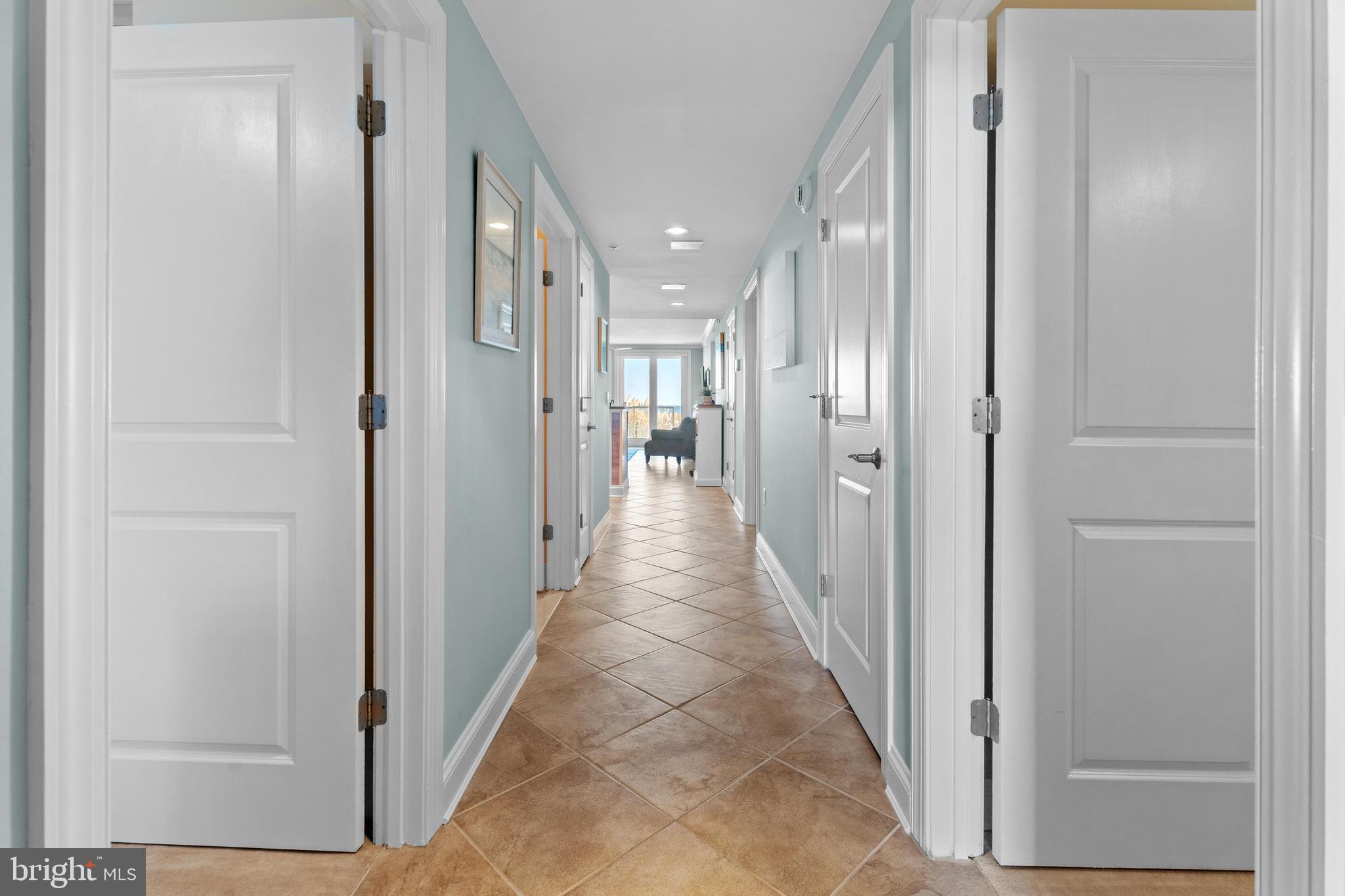 6 60th Street, Unit 102 Ocean City, MD 21842 - Photo 44 of 58 a view of a hallway with wooden shelves