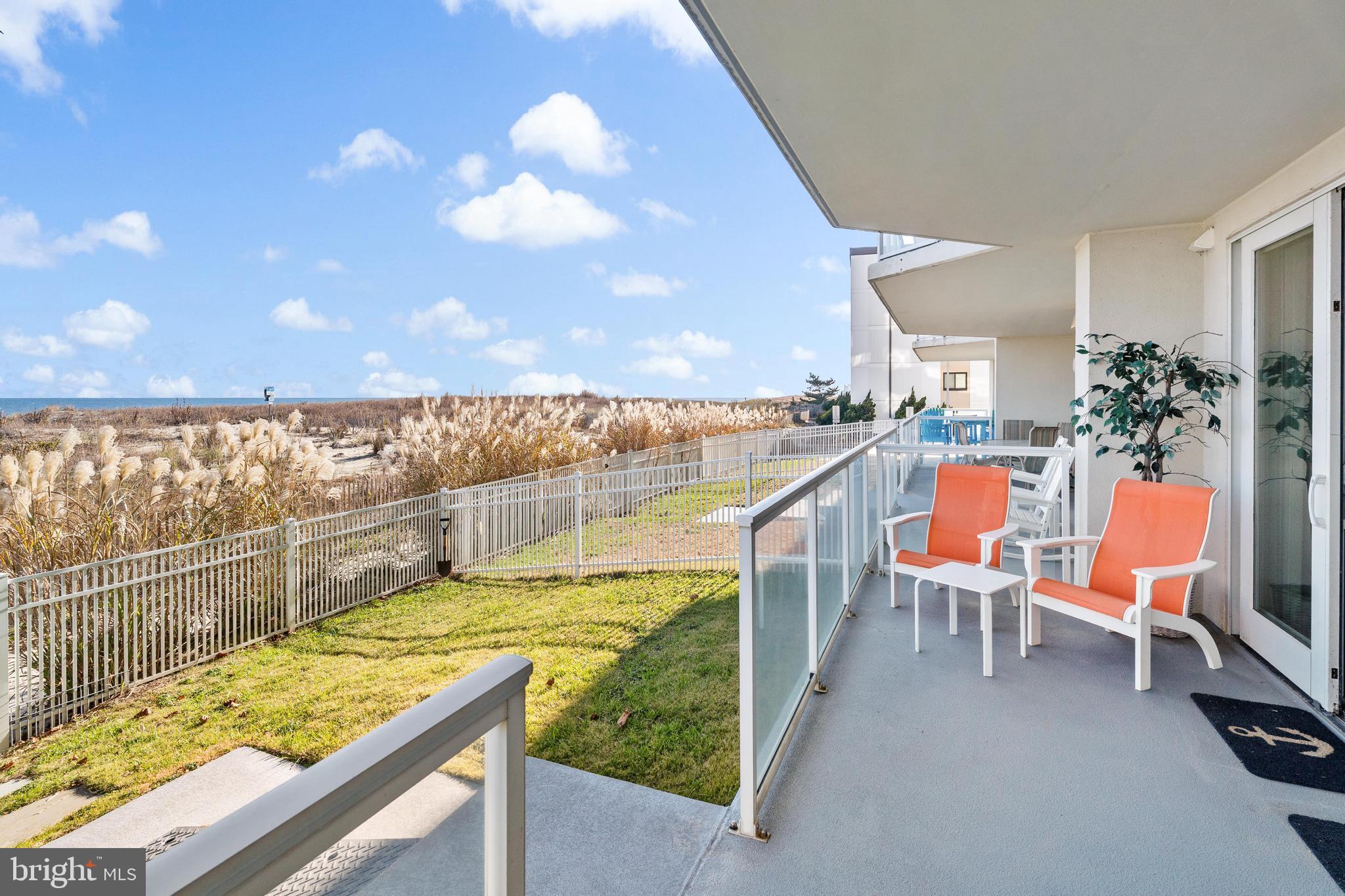 6 60th Street, Unit 102 Ocean City, MD 21842 - Photo 47 of 58 a view of a chairs and table in the balcony