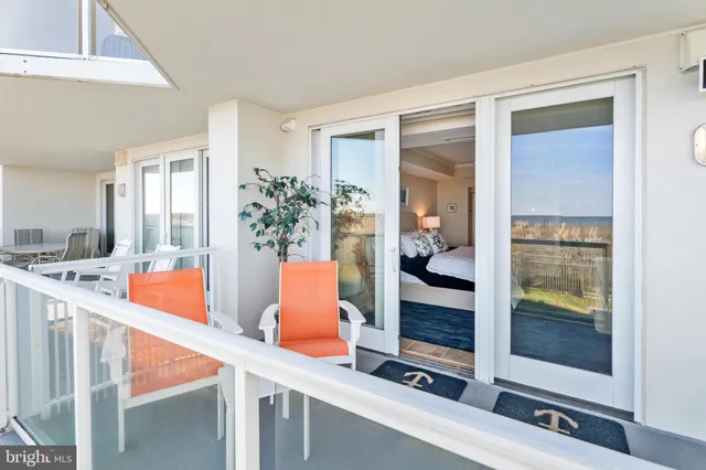 a view of a house with a yard and pathway