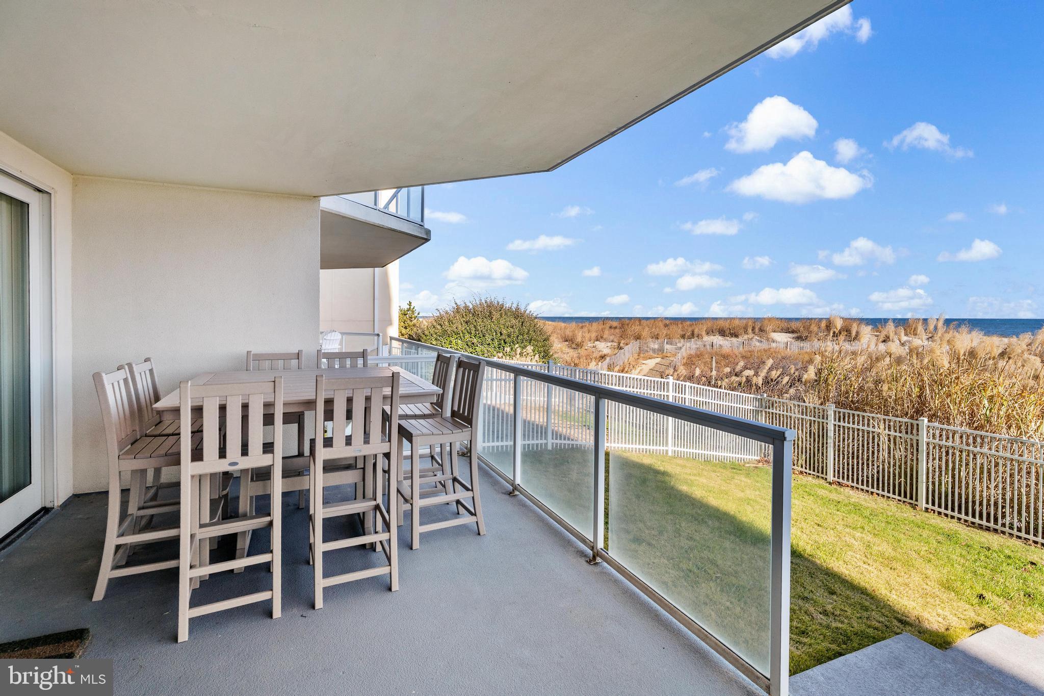 6 60th Street, Unit 102 Ocean City, MD 21842 - Photo 49 of 58 a view of a balcony with chairs