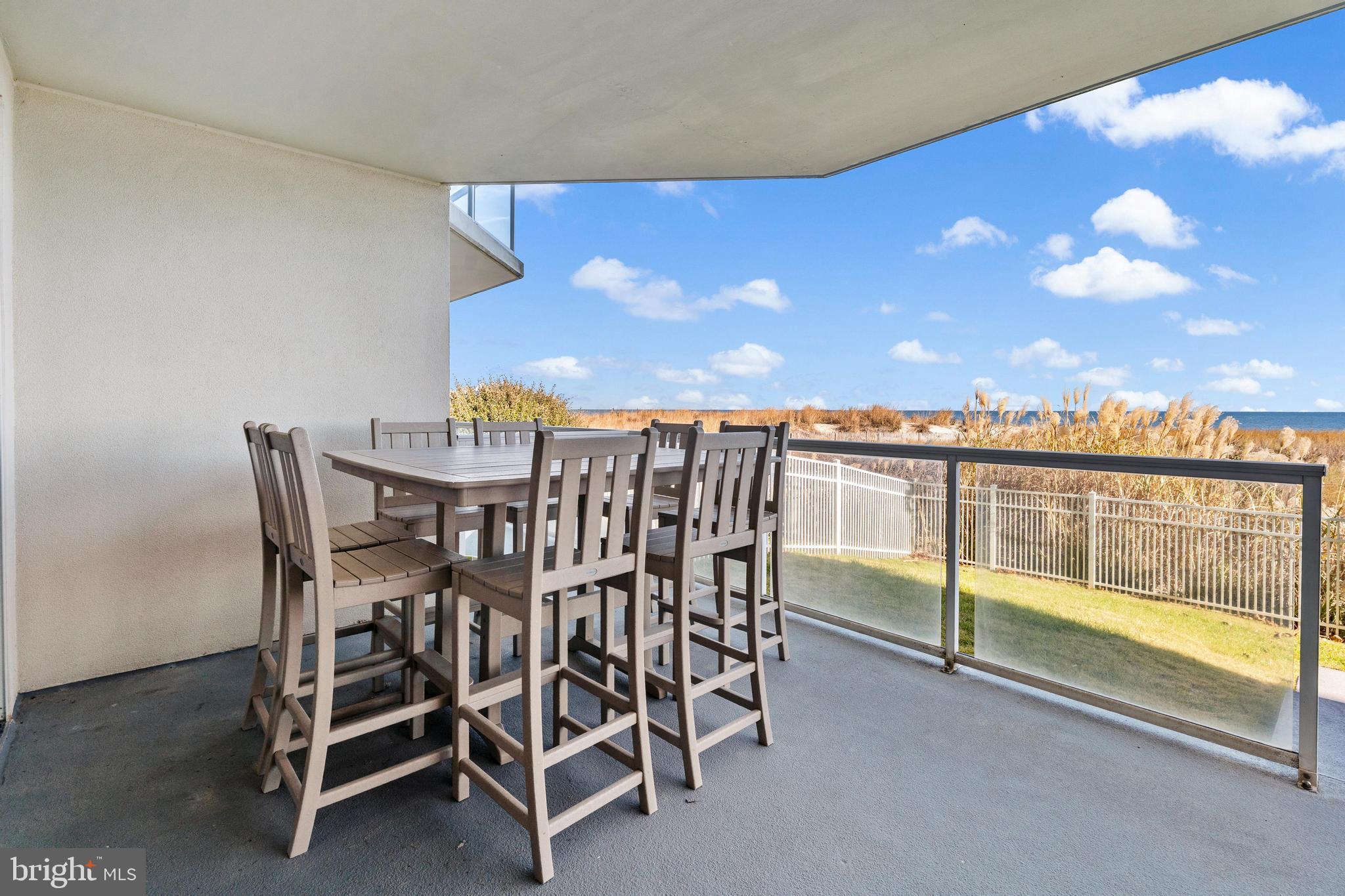 6 60th Street, Unit 102 Ocean City, MD 21842 - Photo 50 of 58 a view of a chairs and table in the terrace
