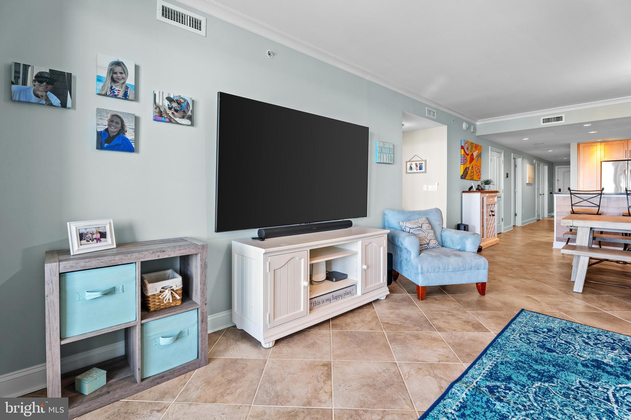 6 60th Street, Unit 102 Ocean City, MD 21842 - Photo 5 of 58 a living room with furniture and a flat screen tv