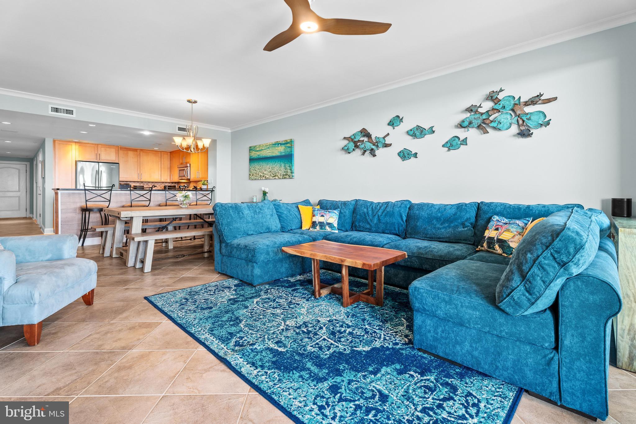 6 60th Street, Unit 102 Ocean City, MD 21842 - Photo 7 of 58 a living room with furniture and a large window