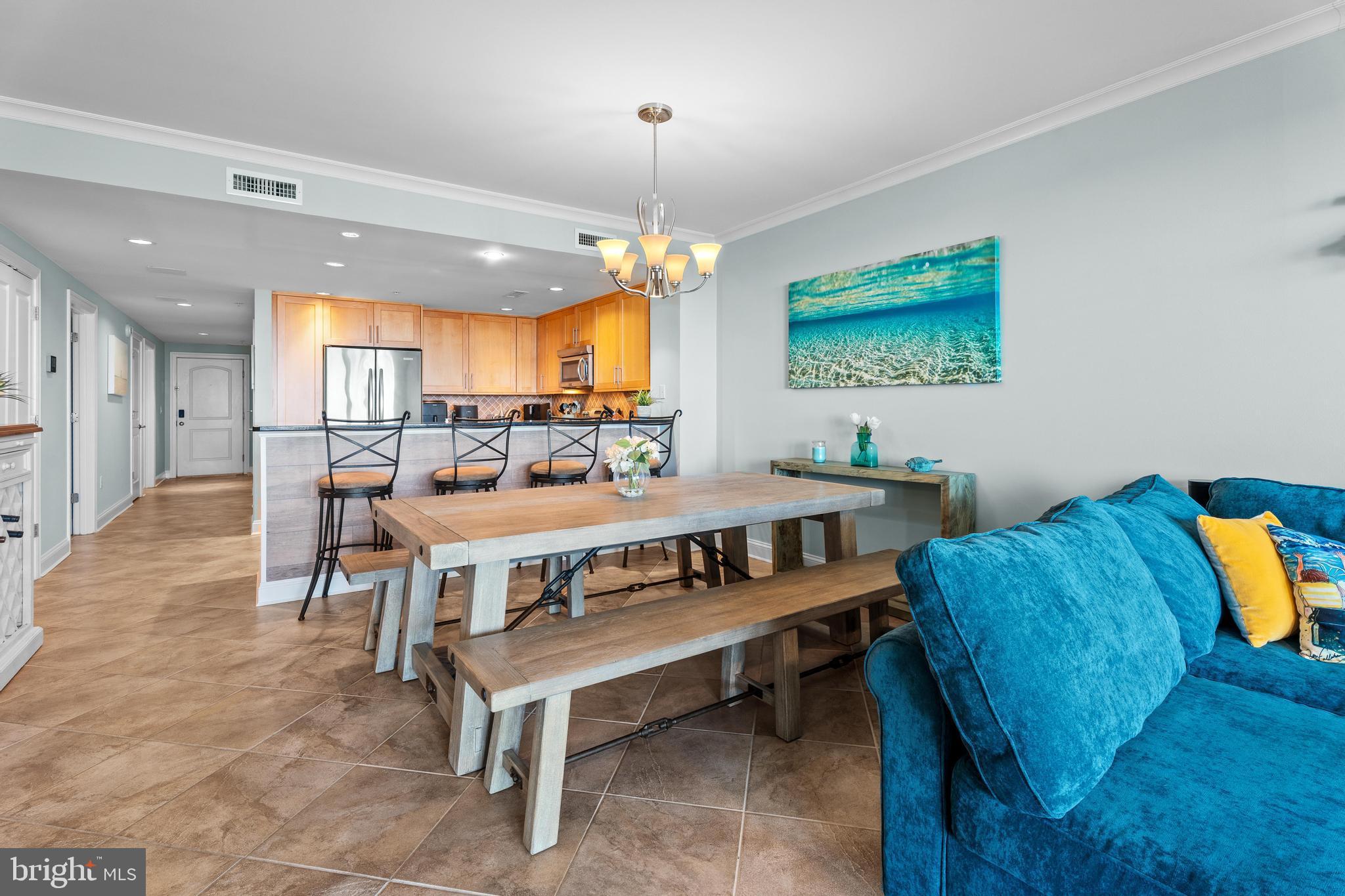 6 60th Street, Unit 102 Ocean City, MD 21842 - Photo 10 of 58 a living room with furniture and a flat screen tv