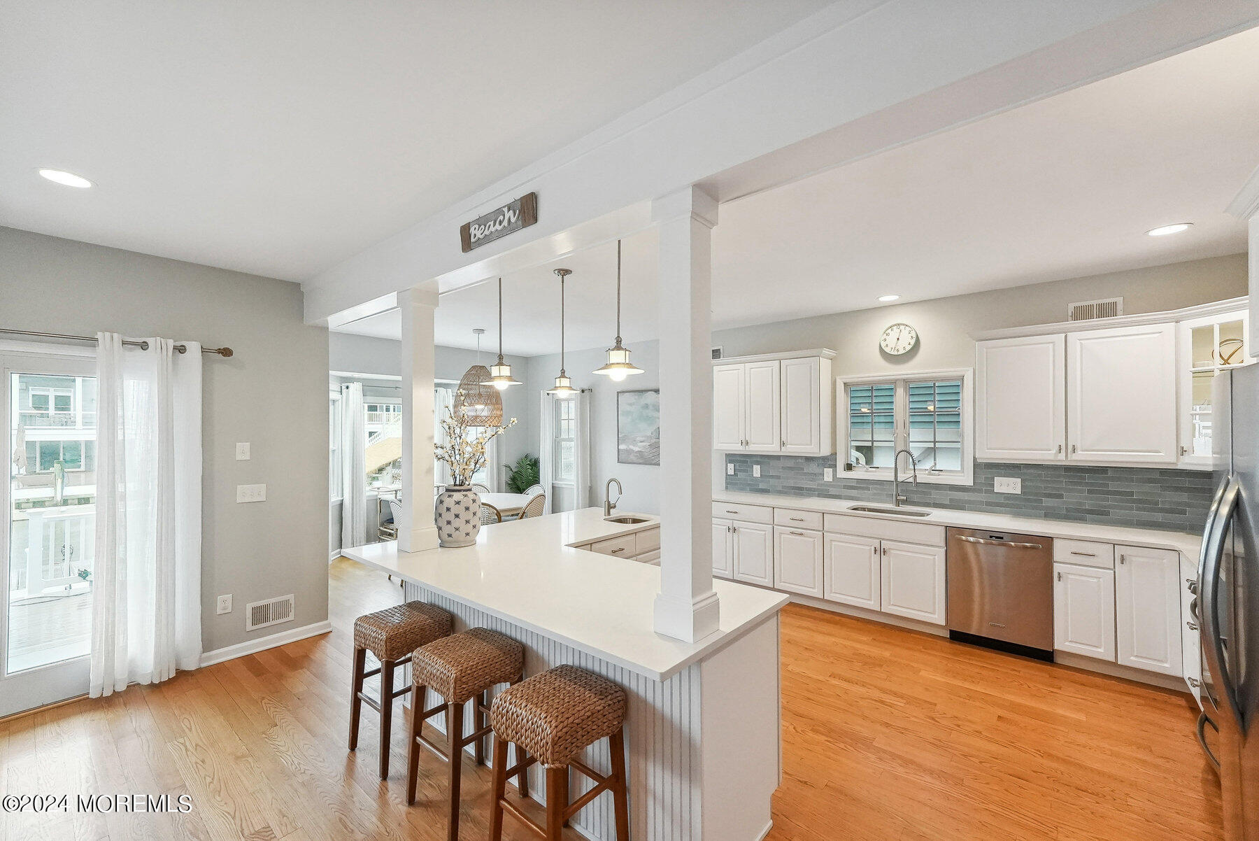 472 Brielle Road Manasquan, NJ 08736 - Photo 13 of 52 a large kitchen with cabinets wooden floor and stainless steel appliances