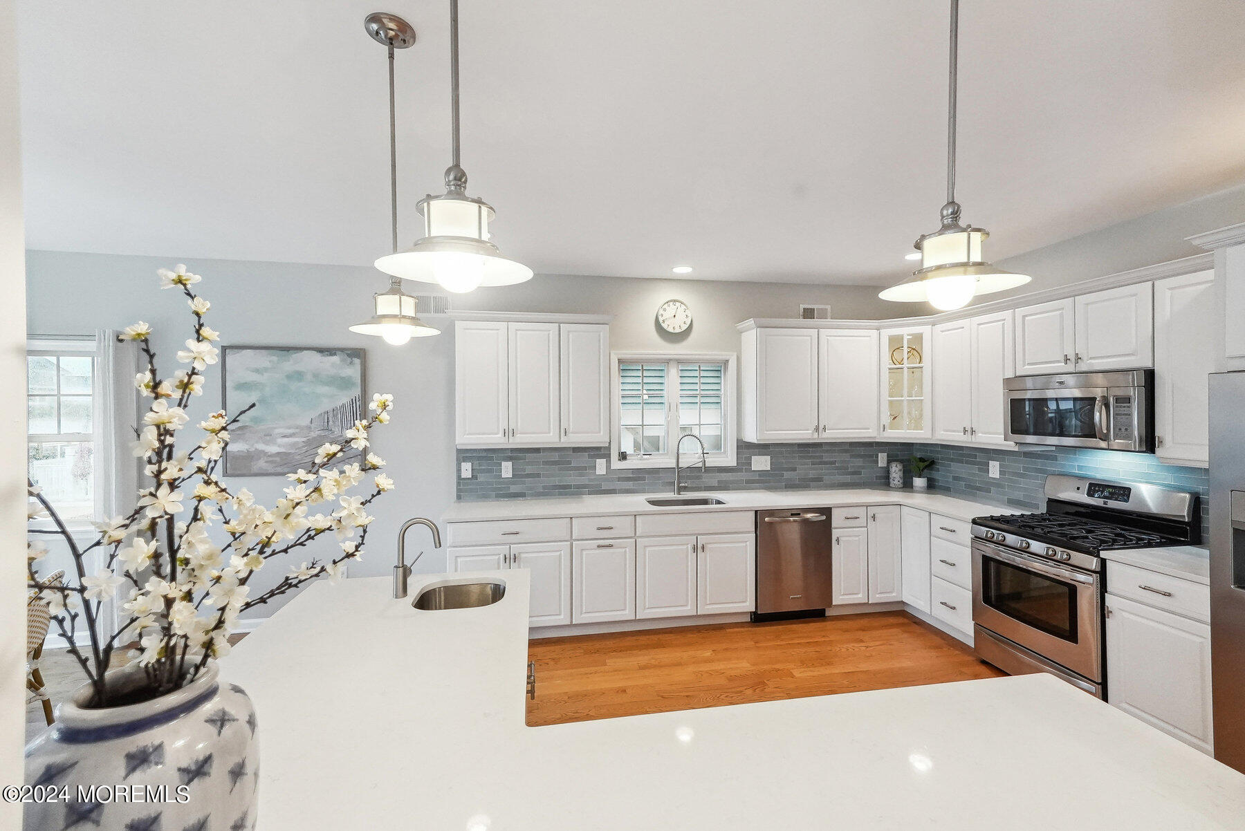 472 Brielle Road Manasquan, NJ 08736 - Photo 15 of 52 a large kitchen with kitchen island a stove a sink a center island and cabinets