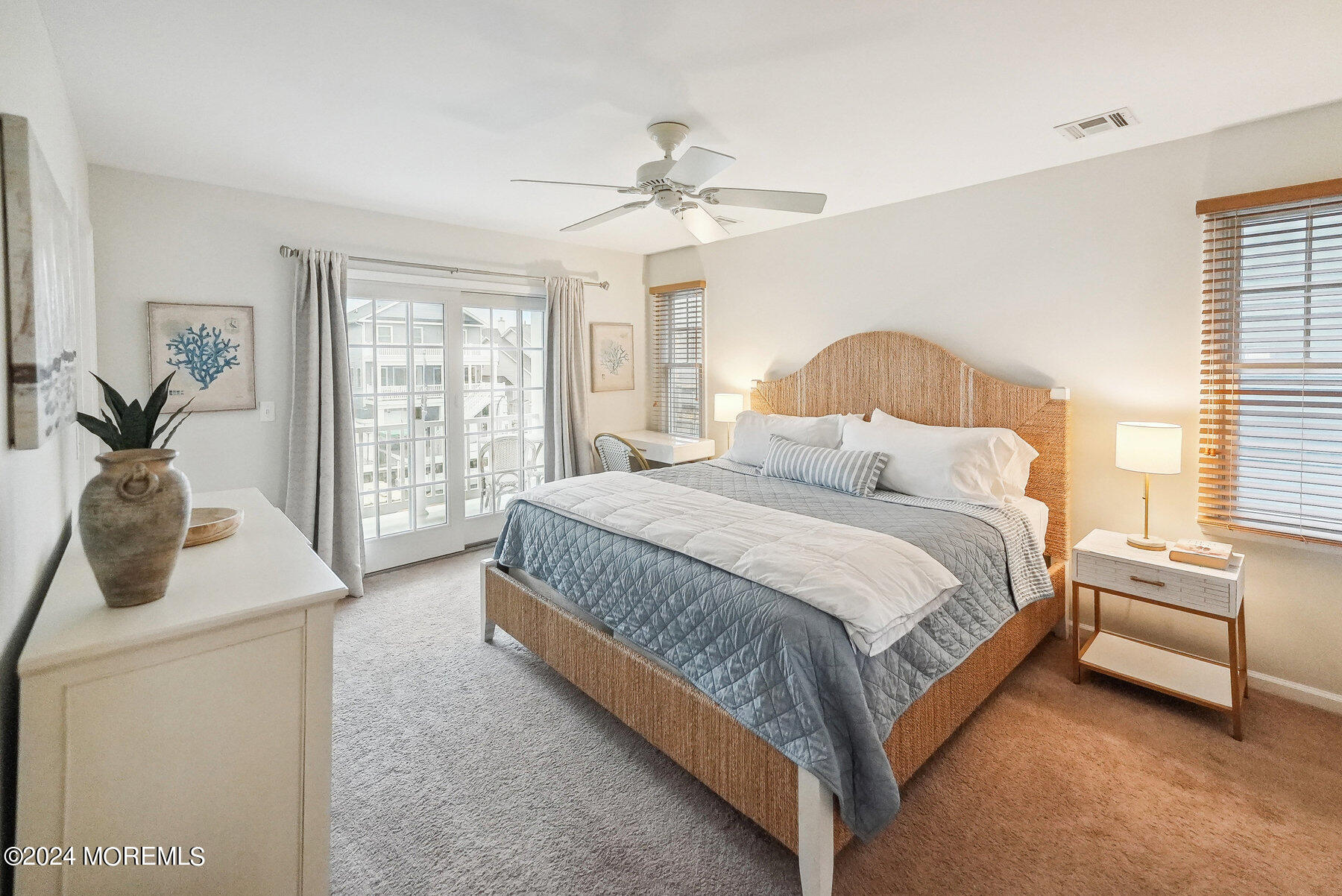 472 Brielle Road Manasquan, NJ 08736 - Photo 19 of 52 a bedroom with a bed and a chandelier