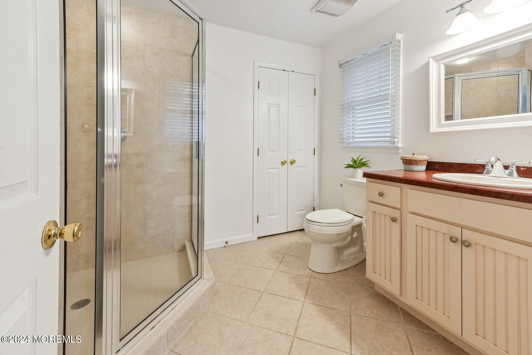 472 Brielle Road Manasquan, NJ 08736 - Photo 21 of 52 a bathroom with a granite countertop sink a toilet and a mirror