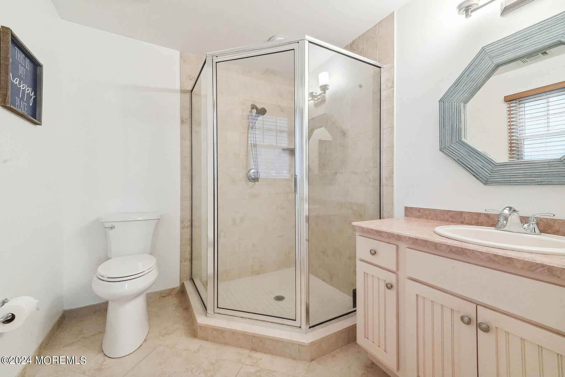 472 Brielle Road Manasquan, NJ 08736 - Photo 24 of 52 a bathroom with a shower sink vanity and toilet