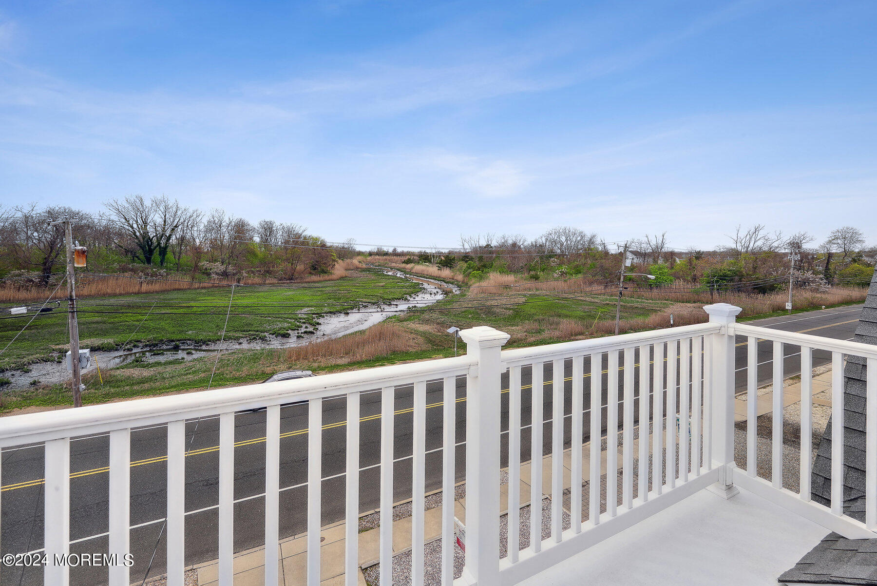 472 Brielle Road Manasquan, NJ 08736 - Photo 29 of 52 a view of a balcony with wooden floor & fence