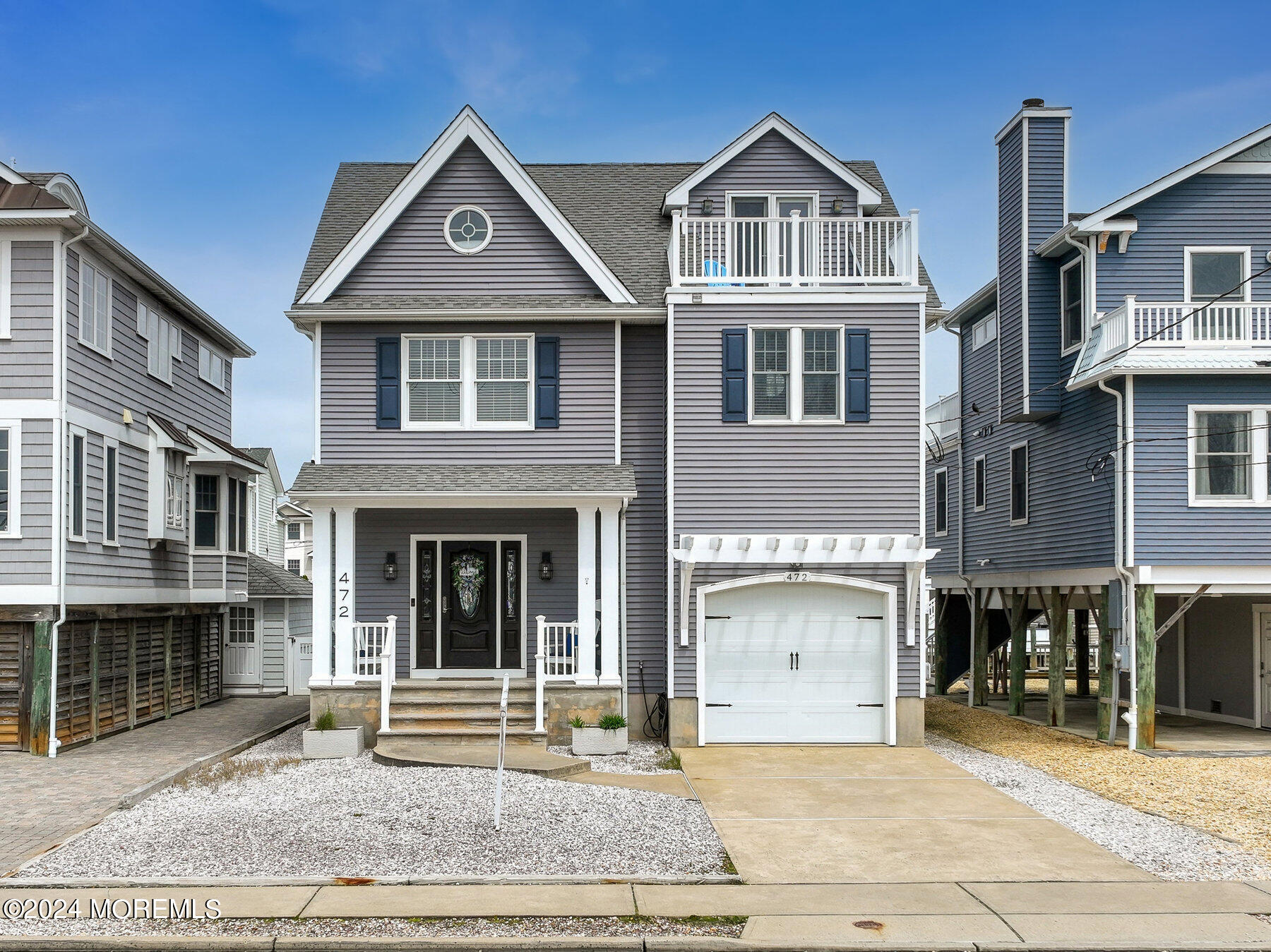 472 Brielle Road Manasquan, NJ 08736 - Photo 3 of 52 a front view of a house with a yard and garage