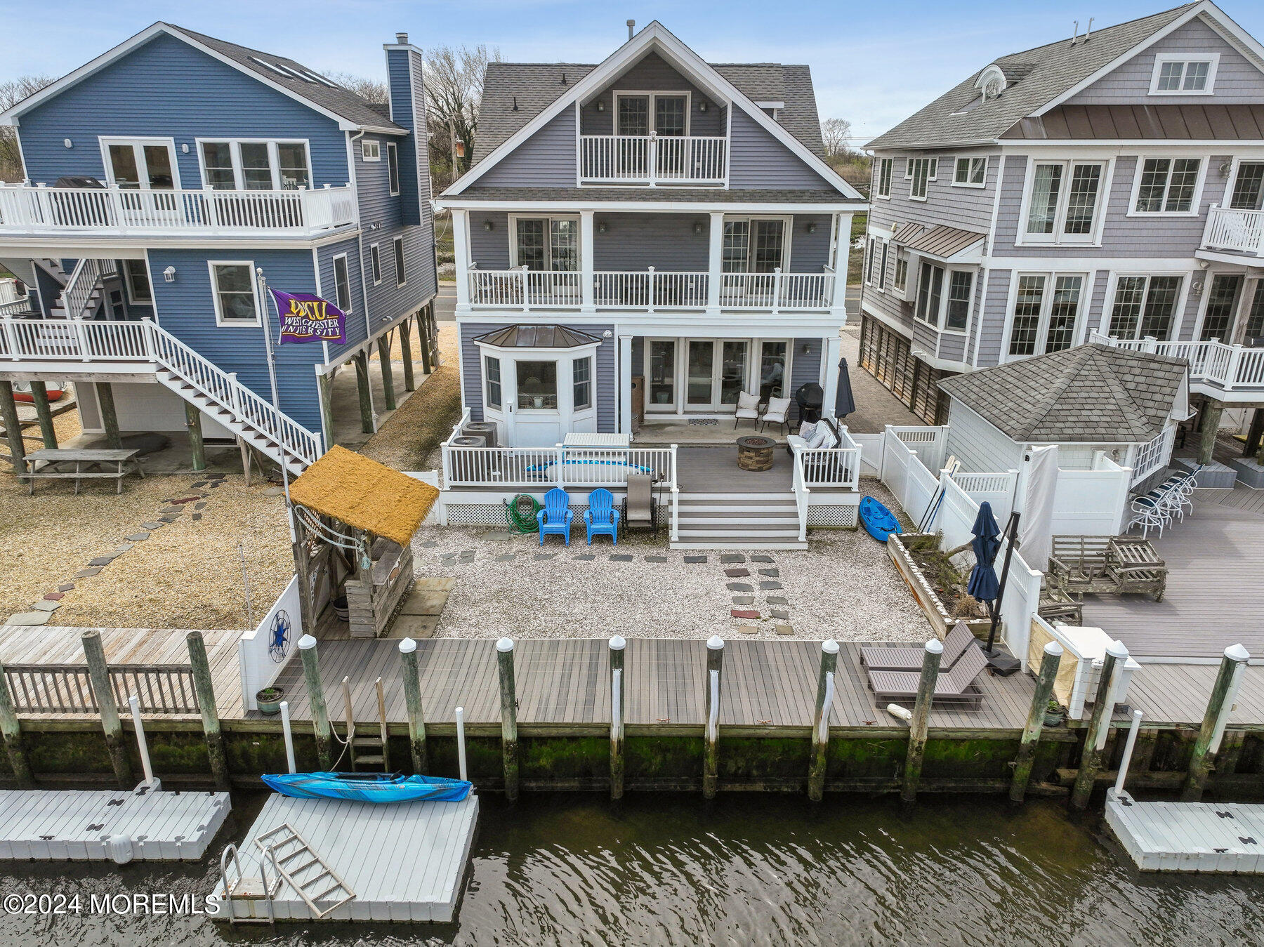 472 Brielle Road Manasquan, NJ 08736 - Photo 7 of 52 a view of a big building with many windows
