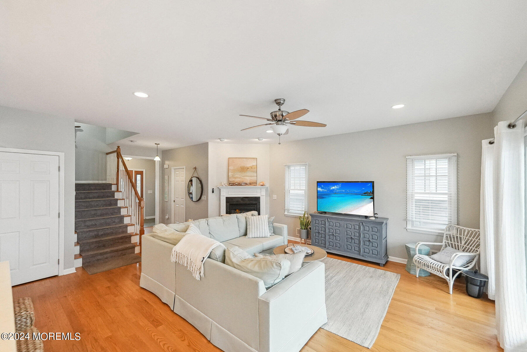 472 Brielle Road Manasquan, NJ 08736 - Photo 10 of 52 a living room with furniture and a chandelier
