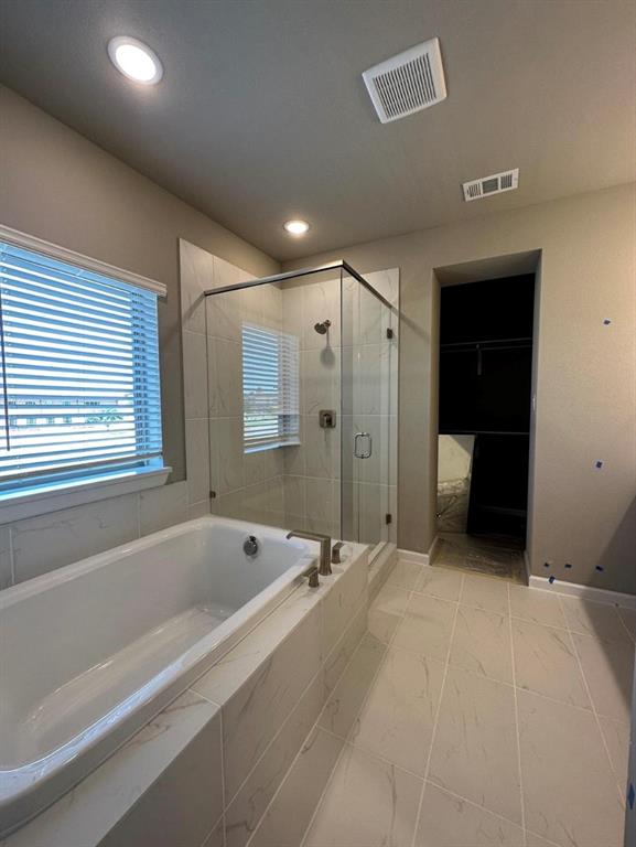 2525 Four Roses Drive Lewisville, TX 75056 - Photo 14 of 19 a spacious bathroom with a bathtub and a shower