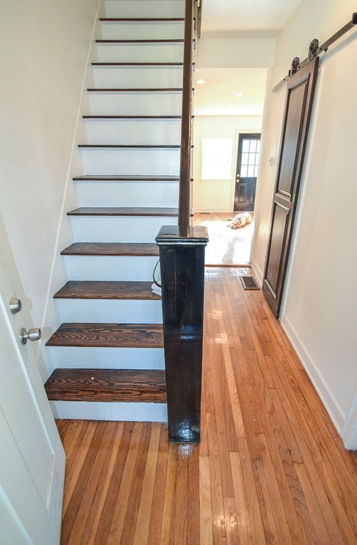 32 Cedar Street, Unit RIGHT Boston, MA 02126 - Photo 11 of 11 a view of entryway with wooden floor