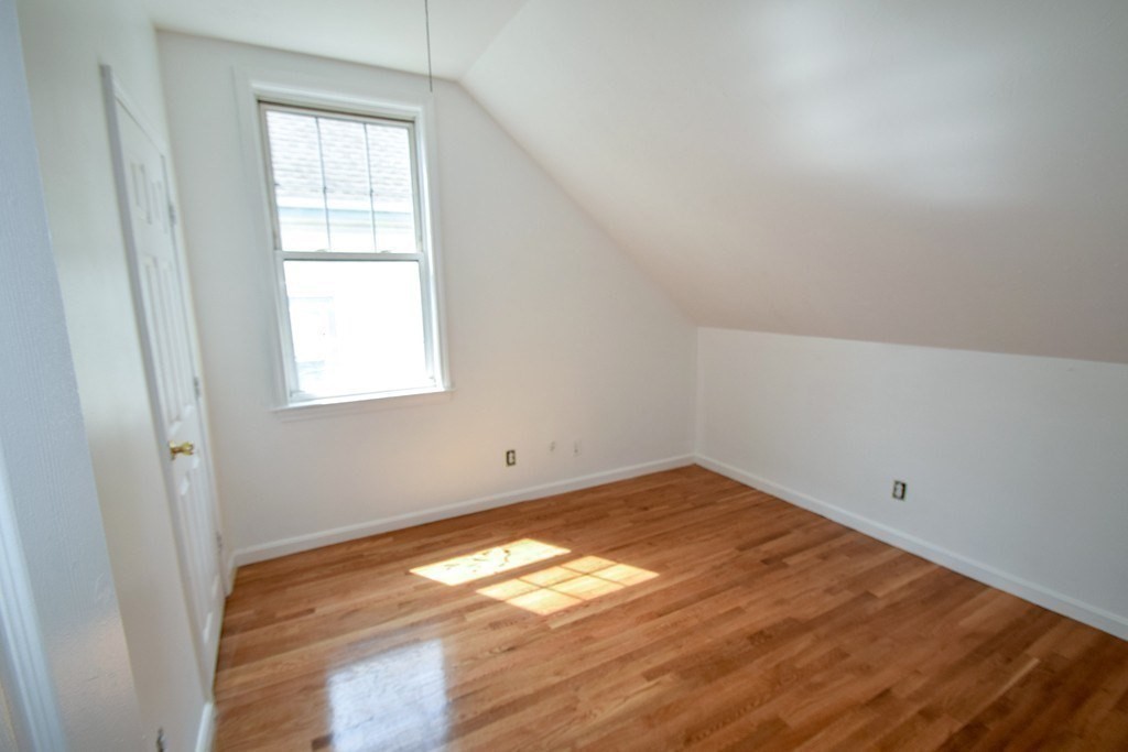 32 Cedar Street, Unit RIGHT Boston, MA 02126 - Photo 9 of 11 an empty room with window