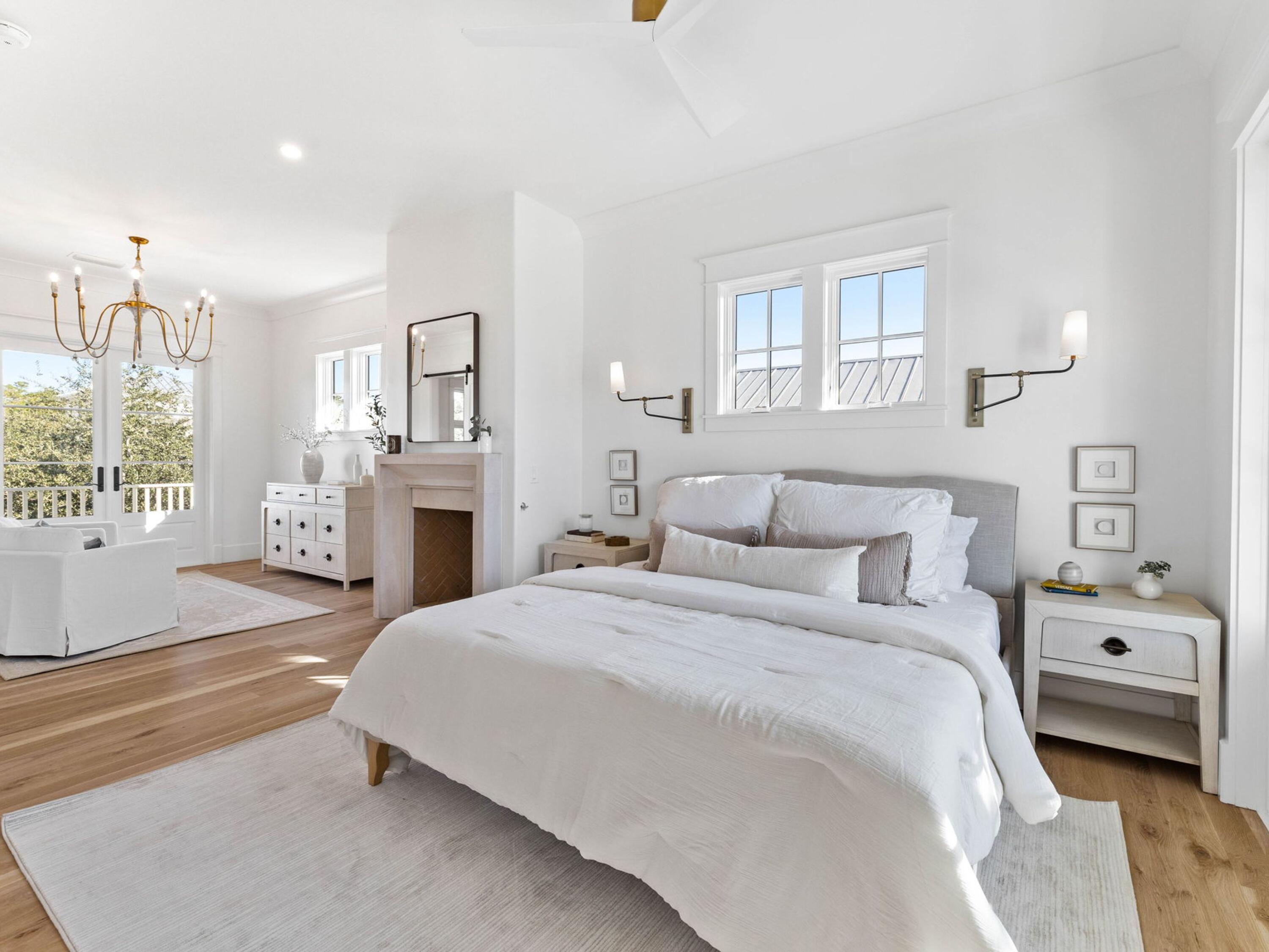 79 Dune Ridge Road Santa Rosa Beach, FL 32459 - Photo 27 of 50 a bedroom with a bed a chandelier and a window
