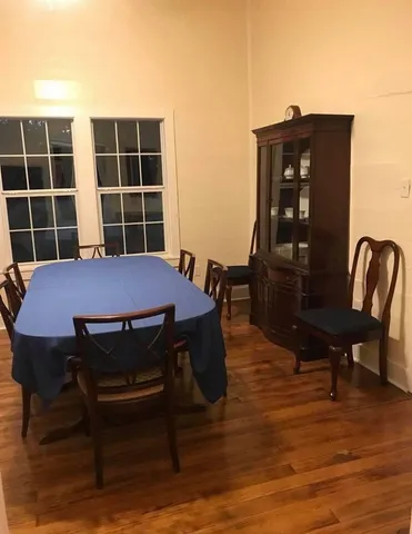 a view of a dinning table and chairs in the patio