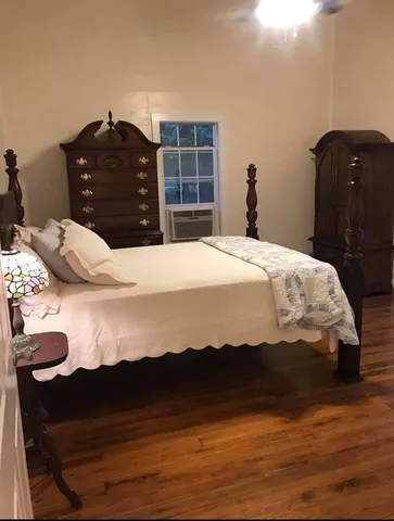 a bedroom with a bed and a closet