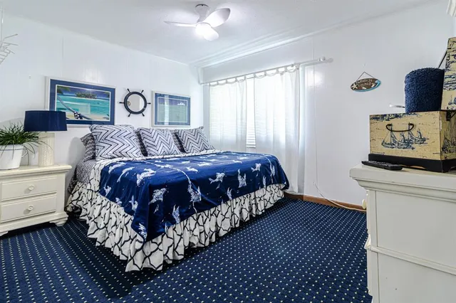 a bedroom with bed and a window