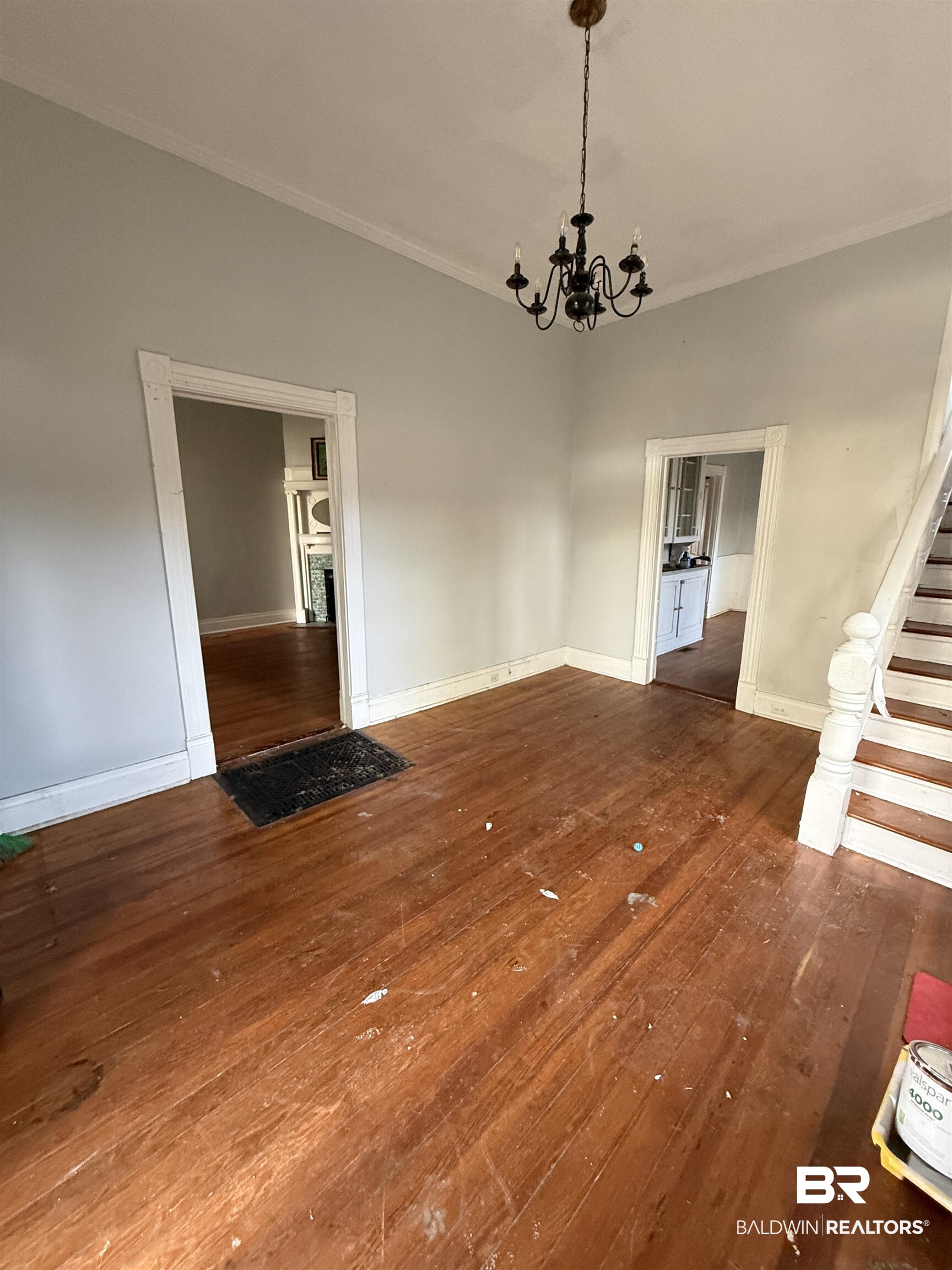 352 South Ann Street Mobile, AL 36604 - Photo 3 of 20 Unfurnished dining area featuring dark wood-style floors, hanging lights, and ornamental molding