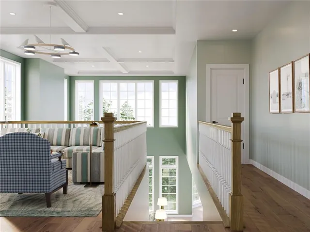 a view of a hallway with furniture and windows