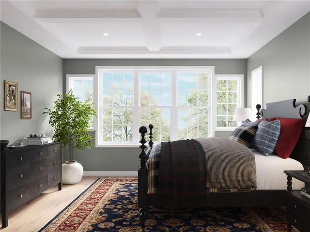 a bedroom with a large bed and a window