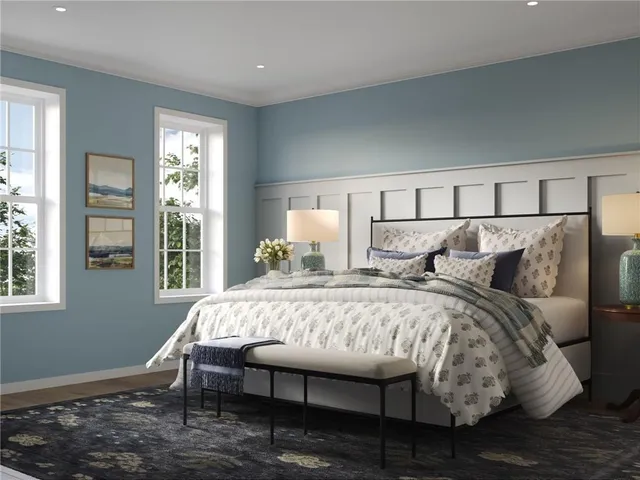 a bedroom with bed and a window