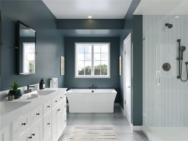 a bathroom with a double vanity sink a mirror and a bathtub