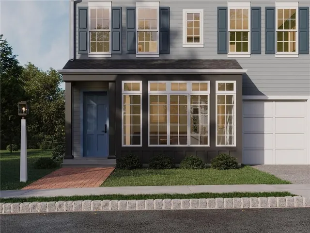 a view of a brick building with a yard