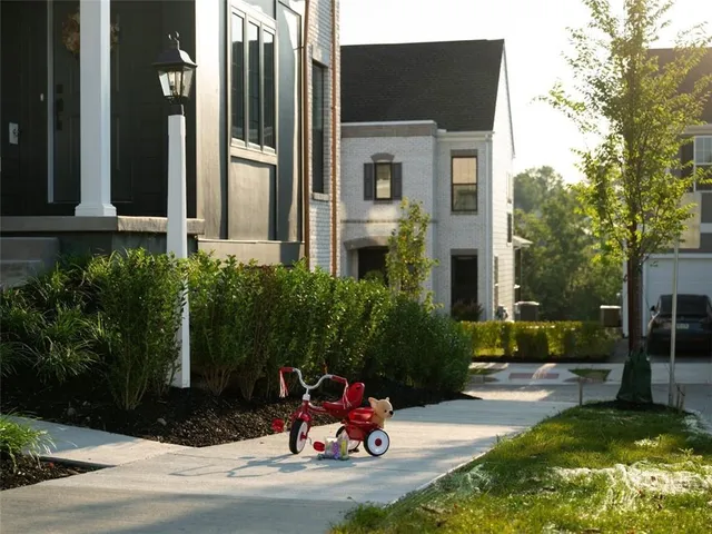 a view of a lake with a yard and a wooden floor