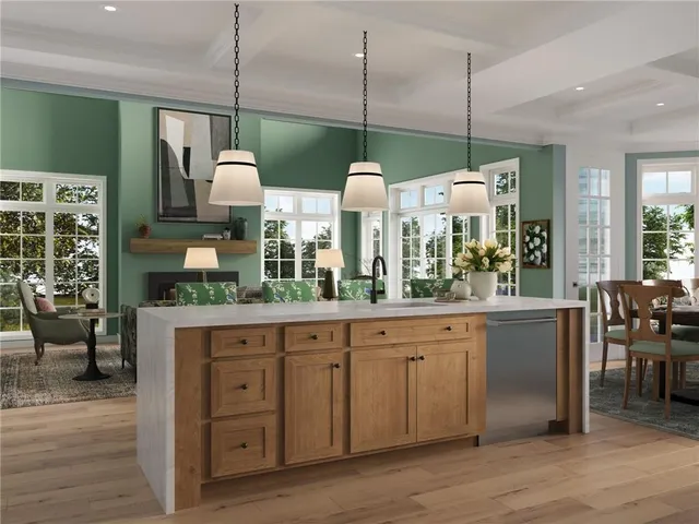 a kitchen with lots of counter space and wooden floor