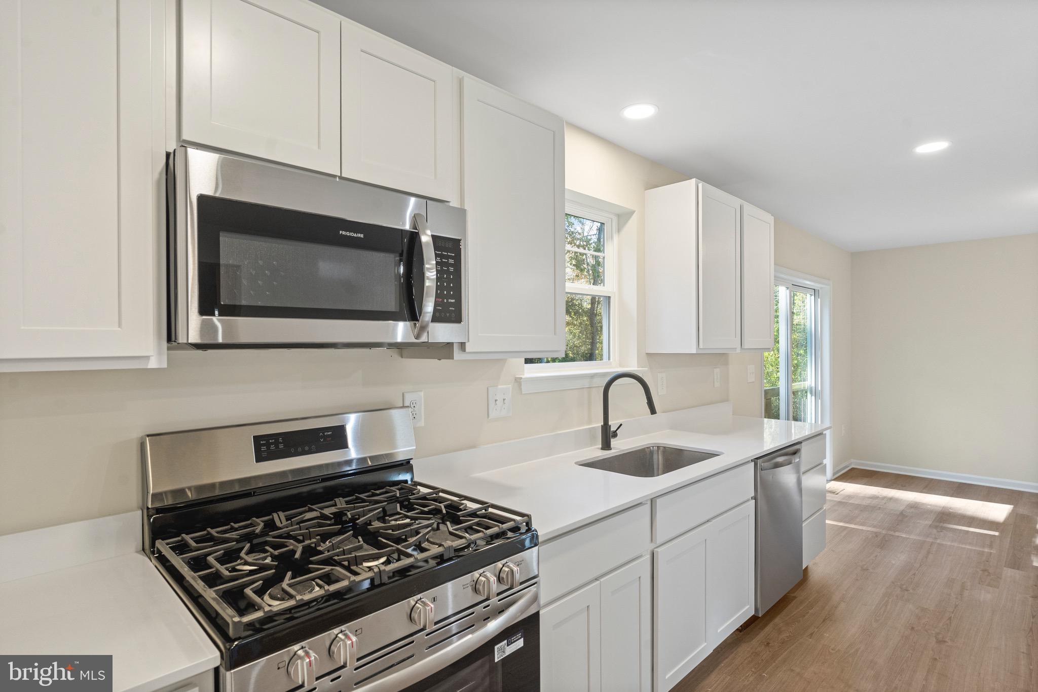 765 Little Mill Road Monroeville, NJ 08343 - Photo 18 of 39 a kitchen that has a sink and a stove top oven