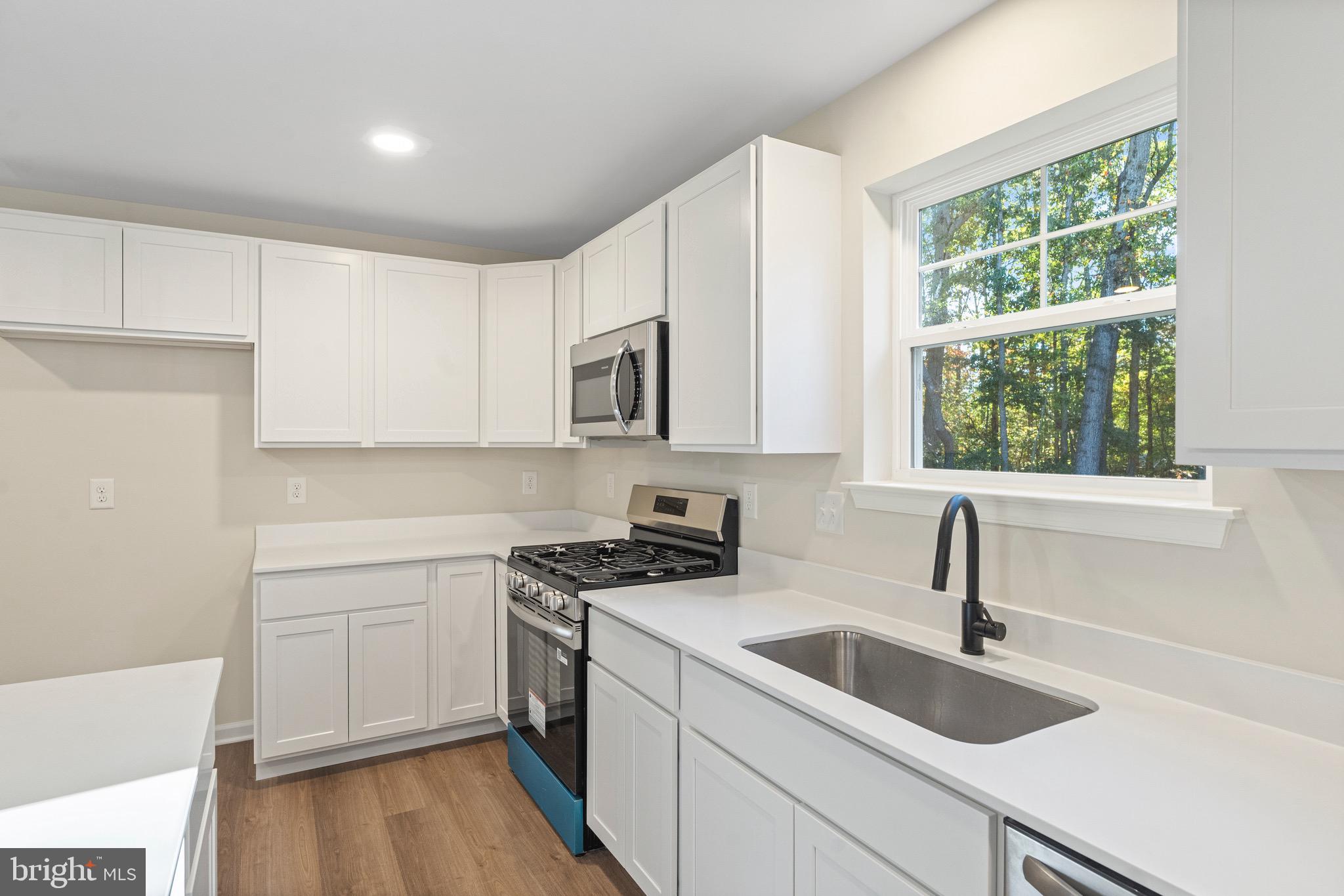 765 Little Mill Road Monroeville, NJ 08343 - Photo 19 of 39 a kitchen with a sink cabinets and window