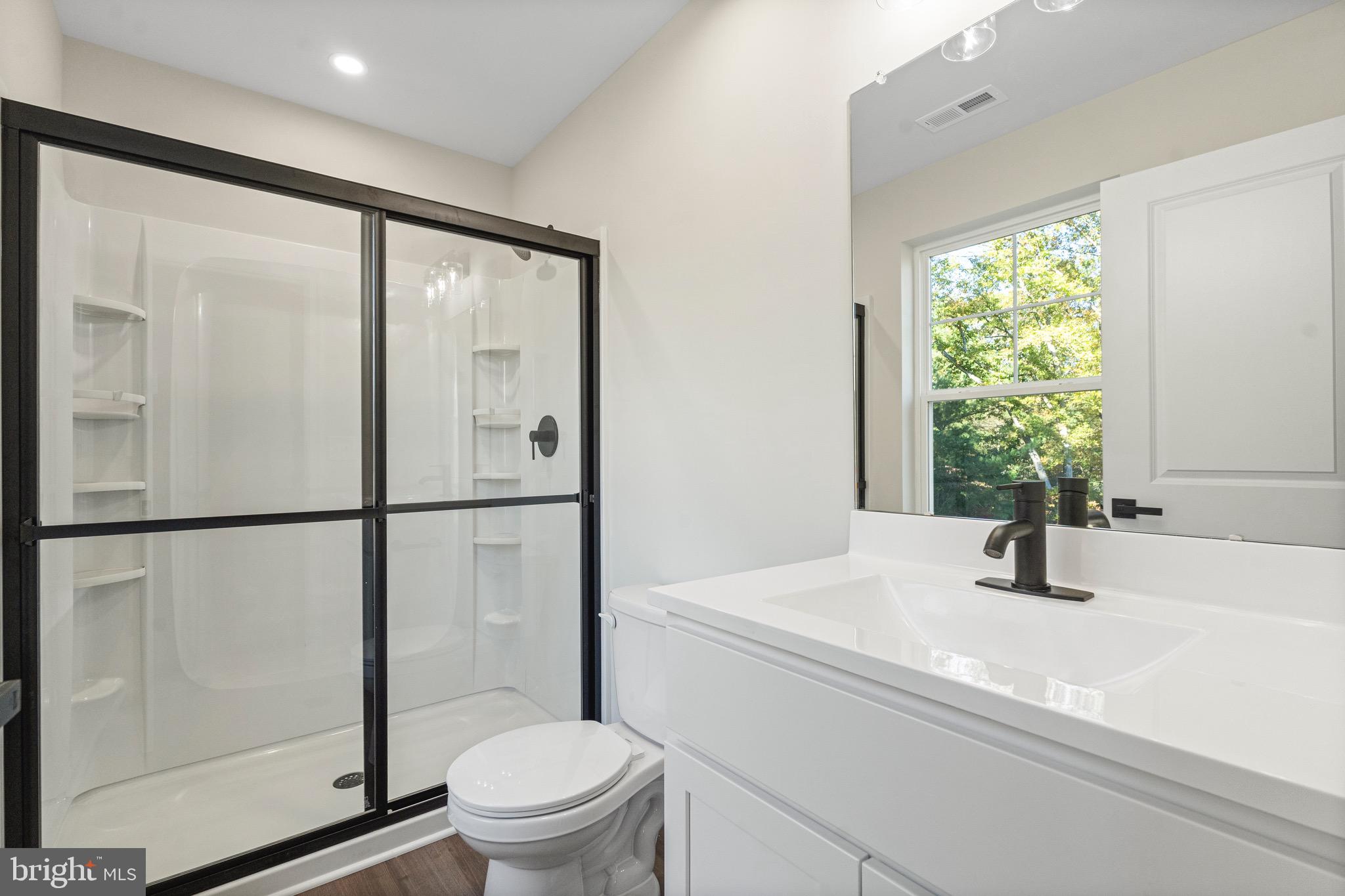 765 Little Mill Road Monroeville, NJ 08343 - Photo 34 of 39 a bathroom with a sink toilet and a mirror